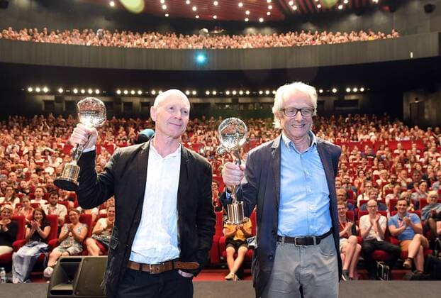 Director Ken Loach, right, and his long-time screenwriter Paul Laverty receive the Crystal Globe for Outstanding Artistic Contribution to World Cinema within the 52nd International Film Festival in Karlovy Vary, Czech Republic, on July 3, 2017. The award was presented to two individuals who together have influenced the history of British cinema. (CTKxPhoto KaterinaxSulova) CTKPhotoP201707030548601  suk16