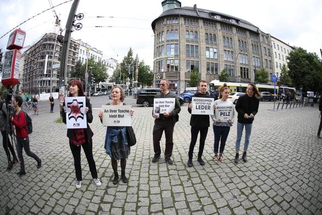 Germany: Demonstration against the agony of the animals Bikini-clad PETA supporters demonstrate with big leather bags at the beginning of the Fashion Week in front of the Jahndorf-Kaufhaus in Berlin Mitte. Sexy action against agony of the animals  SimonexKuhlmey