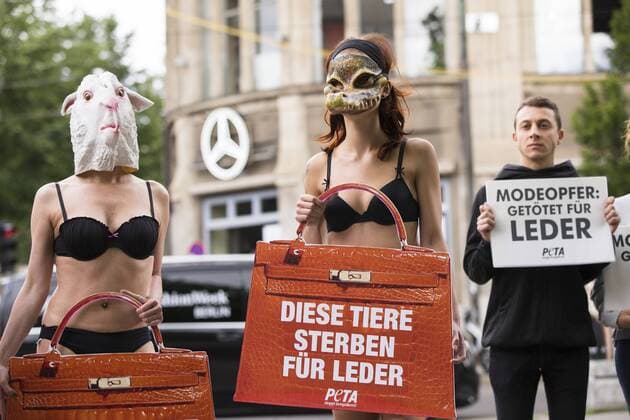 July 4, 2017 - Berlin, Germany - A group of people protest against the use of furs and leather in fashion before the beginning of the Mercedes-Benz Berlin Fashion Week Spring Summer 2018 in front of Jandorf Kaufhaus in Berlin, Germany on July 4, 2017. Berlin Germany  - ZUMAn230 20170704_zaa_n230_162 Copyright: xEmmanuelexContinix