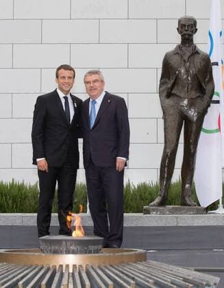 (170711) -- LAUSANNE, July 11,2017 -- French President Emmanuel Macron (L) and International Olympic Committee (IOC) President Thomas Bach pose for picutres in front of the Pierre de Coubertin statue at Olympic Museum in Lausanne, Switzerland, July 10, 2017. Members of IOC will hold a session for presentations by the campaign teams for Los Angeles and Paris on July 11th and 12th. ) (SP)SWITZERLAND-LAUSANNE-OLYMPIC GAMES-2024 BID XuxJinquan 
