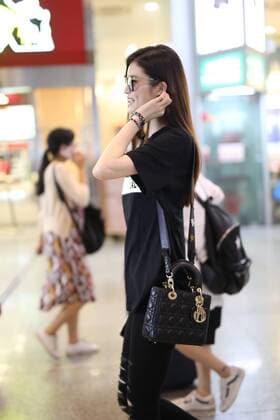 Chinese model He Sui is pictured at the Shanghai Hongqiao International Airport in Shanghai, China, 17 July 2017. Supermodel Hesui showes off her long legs in all-black look at Shanghai airport  pbu653838_08