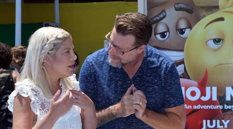 Actress Tori Spelling and her husband Dean McDermott attend the premiere of the animated motion picture comedy The Emoji Movie at the Regency Village Theatre in the Westwood section of Los Angeles on July 23, 2017. Storyline: Gene, a multi-expressional emoji, sets out on a journey to become a normal emoji.  LAP2017072352 JIMxRUYMEN