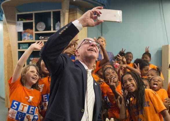 Smithsonian Secretary David Skorton takes a selfie with students after Education Secretary Betsy DeVos and Ivanka Trump read Rosie Revere, Engineer to early grade school children at the Spark Lab at the National Museum of American History in Washington, DC on July 25, 2017. DeVos and Ivanka Trump focused the event on getting girls excited about STEM studies as they participated in certain science experiments.  WAS2017072512 PatxBenic