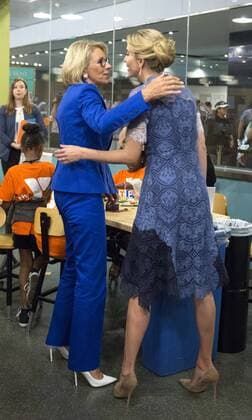 Ivanka Trump and Education Secretary Betsy DeVos hug after they read Rosie Revere, Engineer to early grade school children at the Spark Lab at the National Museum of American History in Washington, DC on July 25, 2017. DeVos and Ivanka Trump focused the event on getting girls excited about STEM studies as they participated in certain science experiments.  WAS2017072531 PatxBenic
