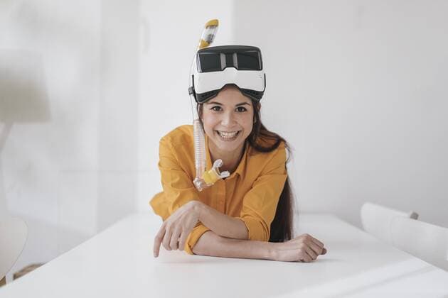 Young woman with VR glasses and snorkel planning next vacation model released Symbolfoto property released  JOSF01083