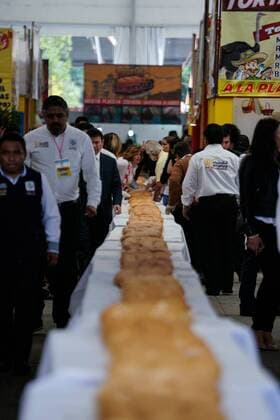 (170727) -- MEXICO CITY, July 27, 2017 -- People take part in the elaboration of a giant Mexican traditional sandwich named Torta during the Torta Fair in Mexico City, capital of Mexico, July 26, 2017. According to local press, during the event which is held from July 26 to 30, people made a torta of 67 meters long and 820 kilograms in weight, trying to break the world record of the largest torta. Francisco Canedo) (zy) MEXICO-MEXICO CITY-TORTA FAIR e FranciscoxCanedo 