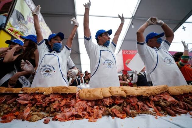 (170727) -- MEXICO CITY, July 27, 2017 -- People take part in the elaboration of a giant Mexican traditional sandwich named Torta during the Torta Fair in Mexico City, capital of Mexico, July 26, 2017. According to local press, during the event which is held from July 26 to 30, people made a torta of 67 meters long and 820 kilograms in weight, trying to break the world record of the largest torta. Francisco Canedo) (zy) MEXICO-MEXICO CITY-TORTA FAIR e FranciscoxCanedo 