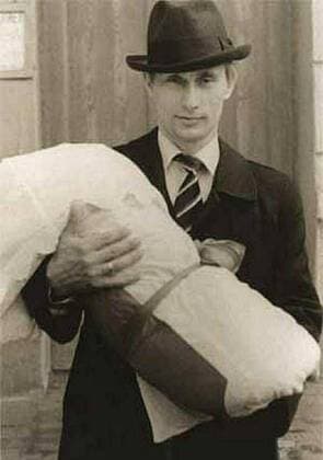 Before rising to power as one of the most infamous leaders in the world, Putin was a playful, hipster-dressing man in love. 1985 - Russia - VLADIMIR PUTIN with his daughter as a young man. St. Petersburg Russia - ZUMAz03_ 79667996st Copyright: xRussianxArchivesx