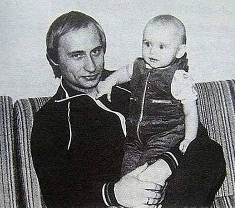 Before rising to power as one of the most infamous leaders in the world, Putin was a playful, hipster-dressing man in love. 1986 - Russia - Young Vladimir Putin with his daughter. St. Petersburg Russia - ZUMAz03_ 79667999st Copyright: xRussianxArchivesx