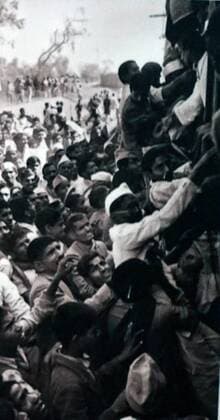 IMAGO ICONS: Mahatma Gandhi crowds travel to New Delhi, to watch the cremation of Mohandas Karamchand Gandhi 1869 – 1948), in 1948. Gandhi was the preeminent leader of the Indian independence movement in British-ruled India. At 5:17 pm on 30 January 1948, Gandhi was with his grandnieces in the garden of the former Birla House (now Gandhi Smriti), on his way to address a prayer meeting, when Nathuram Godse fired three bullets from a Beretta 9 mm pistol into his chest at point-blank range 917_05_WHA_100_0294