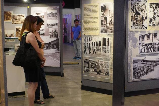 Philippines: HistoryCon 2017 Photo Exhibit of Japanese war being viewed by guests.  GeorgexBuid
