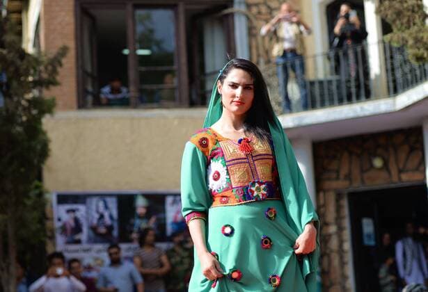 (170811) -- KABUL, Aug. 11, 2017 -- A model presents a costume during a fashion show in Kabul, Afghanistan, on Aug. 10, 2017. More than 20 models including six girls attired in colorful dress attended the catwalk ceremony in Kabul on Thursday to display costumes of ethnic people living in Afghanistan. This is the third time that fashion show was held in the conservative society over the past decade, where Taliban-led militancy is continuing. ) (zy) AFGHANISTAN-KABUL-FASHION SHOW DaixHe 