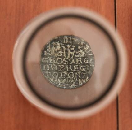 MOSCOW, RUSSIA - AUGUST 14, 2017: A 16th century Polish coin discovered on the construction site for Moscow s Zaryadye Park, on display at the Moscow Government s Cultural Heritage Department. Vyacheslav Prokofyev TASS  TS05B478