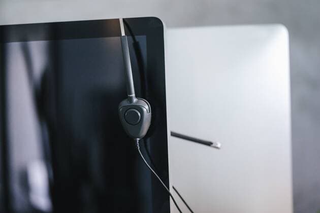 Workspace with headset hanging from computer property released  KNSF02085