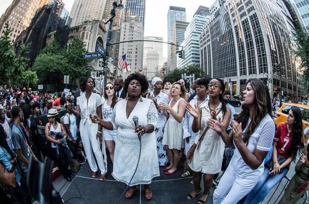 August 23, 2017 - New York City, New York, United States of America - Women s March Choir. New Yorkers rallied behind now-unsigned NFL player Colin Kaepernick who has remained seated during the singing of the US National Anthem since 2016. Kaepernick has stated I am not going to stand up to show pride in a flag for a country that oppresses black people and people of color.Ã¢â‚¬Â Kaepernick exercised his free agency option with the San Francisco 49ers and remains unsigned, which some see as a sign of a blacklisting in the NFL. Calls against Verizon were also made due to its 130 million in advertising with the NFL. New York City United States of America - ZUMAb160 20170823_zbp_b160_038 Copyright: xSachellexBabbarx