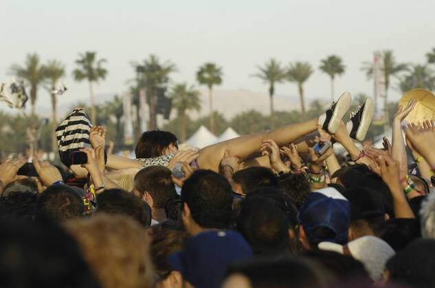 Crowd surfer at the 2011 Coachella Music Festival on March 17, 2011 in Indio. USA - Music - 2011 Coachella Music Festival - Day 3  Copyright: xJaredxMilgrimx