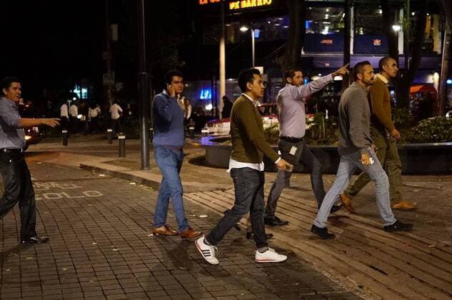 (170908) -- MEXICO CITY, Sept. 8, 2017 -- People walk on a street after an earthquake jolted Mexico City, capital of Mexico, on Sept. 8, 2017. A powerful earthquake measuring 8.0 on the Richter scale struck off Mexico s southern coast on late Thursday, the United States Geological Survey (USGS) said. ) MEXICO-MEXICO CITY-ENVIRONMENT-EARTHQUAKE DavidxdexlaxPaz 
