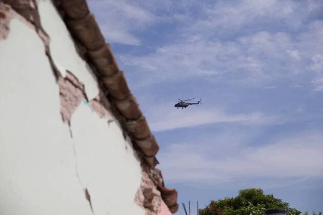 (170909) -- OAXACA (MEXICO), Sept. 9, 2017 -- A rescue helicopter flies over a zone affected by an earthquake in Oaxaca state, Mexico, on Sept. 8, 2017. A powerful earthquake measuring 8.2 on the Richter scale struck off Mexico s southern coast late Thursday night, killing at least 61 people. ) MEXICO-OAXACA-EARTHQUAKE-AFTERMATH DanxHang 