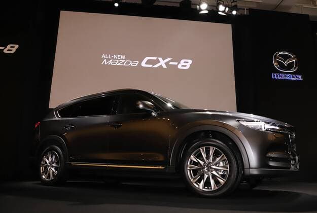 September 14, 2017, Tokyo, Japan - Japan s automaker Mazda displays the new sports utility vehicle (SUV) CX-8 in Tokyo on Thursday, September 14, 2017. The new crossover SUV has a turbo charged 2.2-litre diesel engine to drive three-row seats roomy body.  (lwxa013592)