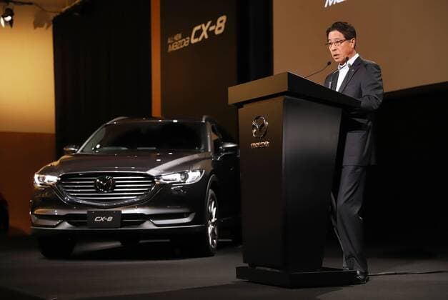 September 14, 2017, Tokyo, Japan - Japan s automaker Mazda president Masamichi Kogai introduces the new sports utility vehicle (SUV) CX-8 in Tokyo on Thursday, September 14, 2017. The new crossover SUV has a turbo charged 2.2-litre diesel engine to drive three-row seats roomy body.  (lwxa013604)