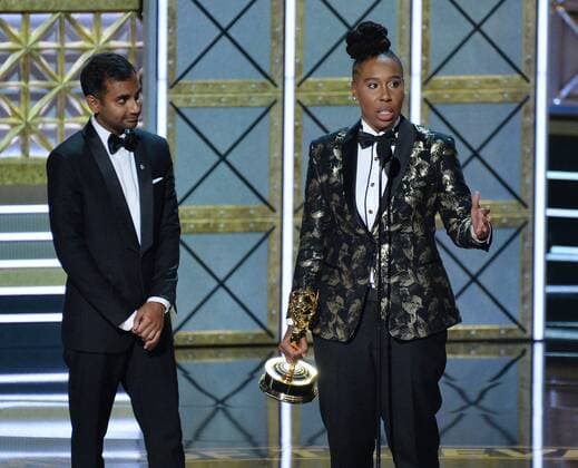 Writers Aziz Ansari (L) and Lena Waithe accept the award for Outstanding Writing for a Comedy Series for Master of None onstage during the 69th annual Primetime Emmy Awards at Microsoft Theater in Los Angeles on September 17, 2017.  LAP201709170187 JIMxRUYMEN