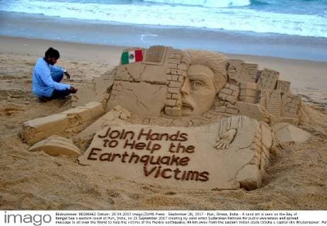 September 20, 2017 - Puri, Orissa, India - A sand art is seen on the Bay of Bengal Sea s eastern coast at Puri, India, on 21 September 2017 creating by sand artist Sudarshan Pattnaik for public awareness and spread message to all over the World to help the victims of the Mexico earthquake, 65 km away from the eastern Indian state Odisha s capital city Bhubaneswar. Puri India  - ZUMAn230 20170920_zaa_n230_507 Copyright: xStrx