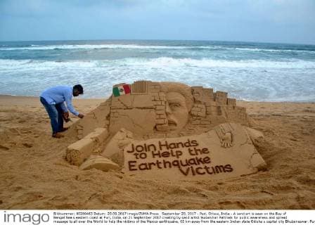 September 20, 2017 - Puri, Orissa, India - A sand art is seen on the Bay of Bengal Sea s eastern coast at Puri, India, on 21 September 2017 creating by sand artist Sudarshan Pattnaik for public awareness and spread message to all over the World to help the victims of the Mexico earthquake, 65 km away from the eastern Indian state Odisha s capital city Bhubaneswar. Puri India  - ZUMAn230 20170920_zaa_n230_508 Copyright: xStrx