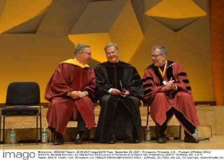 September 23, 2017 - Minneapolis, Minnesota, U.S. - President of Finland, SAULI NIINISTO, Receives Honorary Law Degree from the University of Minnesota at Orchestra Hall. Presented by DEAN E. JOHNSON, left, U of M Regent, ERIC W. KALER, right. Minneapolis U.S. - ZUMAu22_ 20170923_sha_u22_725 Copyright: xSeanxSmudax