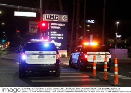 A police block around the University Medical Center where many victims of the Route 91 Harvest country music festival shooting were transported to after apparent gun fire was heard around the Mandalay Bay Resort and Casino in Las Vegas, Nevada on October 1, 2017. More than 20 people were killed and at least 100 others injured after a gunman opened fire Sunday night at a country music festival opposite the Mandalay Bay hotel and resort on the Las Vegas Strip, authorities said.  LAV2017100220 JAMESxATOA