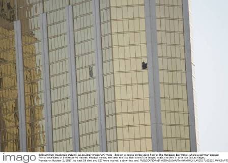 Broken windows on the 32nd floor of the Mandalay Bay Hotel, where a gunman opened fire on attendees of the Route 91 Harvest Festival venue, are seen the day after one of the largest mass murders in America, in Las Vegas, Nevada on October 2, 2017. At least 59 died and 527 were injured, authorities said.  LAV2017100232 JAMESxATOA