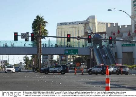 Police cars block the Las Vegas Strip in front of the Mandalay Bay Hotel, where a gunman opened fire from the 32nd floor on attendees of the Route 91 Harvest Festival venue, one day after one of the largest mass murders in America, in Las Vegas, Nevada on October 2, 2017. At least 59 died and 527 were injured, authorities said.  LAV2017100298 JAMESxATOA
