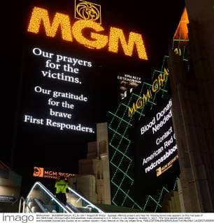 Signage offering prayers and help for missing loved ones appears on the marquee of the MGM Hotel, 24-hours after the deadliest mass shooting in U.S. history in Las Vegas on October 2, 2017. Fifty-nine people were killed and hundreds injured late Sunday at an outdoor country music festival on the Las Vegas Strip.  LAV20171002808 JIMxRUYMEN