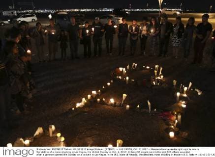 (171003) -- LAS VEGAS, Oct. 3, 2017 -- People attend a candle light vigil to mourn the victims of a mass shooting in Las Vegas, the United States, on Oct. 2, 2017. At least 59 people were killed and 527 others wounded after a gunman opened fire Sunday on a concert in Las Vegas in the U.S. state of Nevada, the deadliest mass shooting in modern U.S. history. ) (zy) U.S.-LAS VEGAS-SHOOTING-MOURNING WangxYing 
