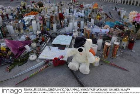 A makeshift memorial for the victims of the country music festival mass shooting appears on the northwest corner of Sahara and Las Vegas Blvd. in Las Vegas on October 3, 2017. Fifty-nine people were killed and hundreds injured late Sunday at an outdoor country music festival on the Las Vegas Strip.  LAV20171003804 JIMxRUYMEN