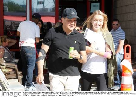 Two blood donors with bandages on their arms leaving United Blood Services in Las Vegas, Nevada on October 3, 2017.  LAV2017100309 JAMESxATOA