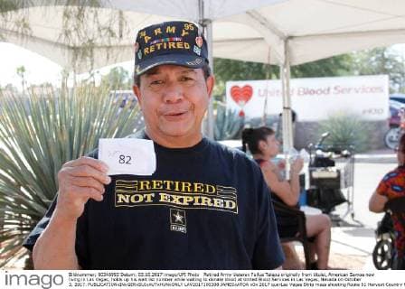 Retired Army Veteran Faifua Talapu originally from Utulei, American Samoa now living in Las Vegas, holds up his wait list number while waiting to donate blood at United Blood Services in Las Vegas, Nevada on October 3, 2017.  LAV2017100308 JAMESxATOA