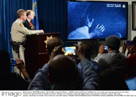 LVMPD Undersheriff Kevin McMahill (L) views body cam footage with reporters taken during the mass shooting at Sunday s outdoor country music festival on the Las Vegas Strip in Las Vegas on October 3, 2017. Fifty-nine people, including the shooter were killed and over 500 injured.  LAV20171003809 JIMxRUYMEN