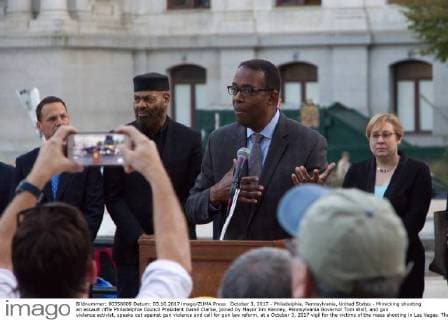 October 3, 2017 - Philadelphia, Pennsylvania, United States - Mimicking shooting an assault riffle Philadelphia Council President Darell Clarke, joined by Mayor Jim Kenney, Pennsylvania Governor Tom Wolf, and gun violence activist, speaks out against gun violence and call for gun law reform, at a October 3, 2017 vigil for the victims of the mass shooting in Las Vegas. The vigil is held outside City Hall, in Philadelphia, PA. Philadelphia United States - ZUMAn230 20171003_zaa_n230_781 Copyright: xBastiaanxSlabbersx