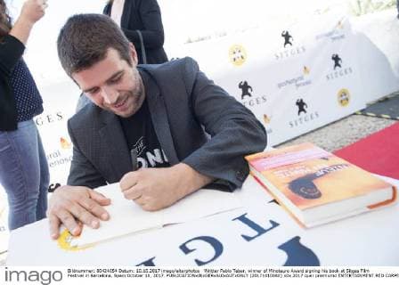 Writter Pablo Tebar, winner of Minotauro Award signing his book at Sitges Film Festival in Barcelona, Spain October 10, 2017.  (20171010080)