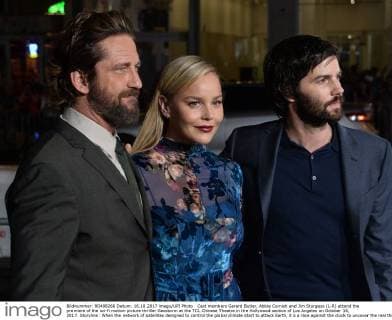 Cast members Gerard Butler, Abbie Cornish and Jim Sturgess (L-R) attend the premiere of the sci-fi motion picture thriller Geostorm at the TCL Chinese Theatre in the Hollywood section of Los Angeles on October 16, 2017. Storyline: When the network of satellites designed to control the global climate start to attack Earth, it s a race against the clock to uncover the real threat before a worldwide geostorm wipes out everything and everyone.  LAP2017101625 JIMxRUYMEN
