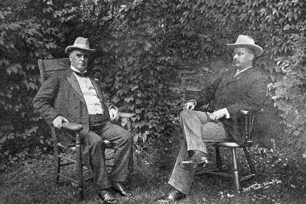President William McKinley and Vice President Theodore Roosevelt sitting, in chairs, outside on a lawn, New York, 1900. 1023_05_65226final