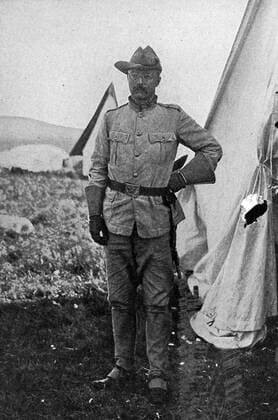 Portrait of Colonel Theodore Roosevelt standing by a tent at a camp at Montauk, New York, 1898. 1023_05_65228final