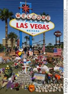 A memorial for the slain victims of the Route 91 Harvest music festival mass shooting is shown next to the historic Welcome to Las Vegas sign on October 19, 2017, in Las Vegas. A gunman opened fire on the music, leaving 58 dead and over 500 injured on October 1.  LAV2017101901 RONDAxCHURCHILL