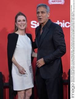 Cast members Julianne Moore and George Clooney attend the premiere of the motion picture crime thriller Suburbicon at the Regency Village Theatre in the Westwood section of Los Angeles on October 22, 2017. Storyline: Suburbicon is a peaceful, idyllic suburban community with affordable homes and manicured lawnsÉthe perfect place to raise a family, and in the summer of 1959, the Lodge family is doing just that. But the tranquil surface masks a disturbing reality, as husband and father Gardner Lodge (Matt.Damon) must navigate the townÕs dark underbelly of betrayal, deceit, and violence. This is a tale of.very flawed people making very bad choices. This is Suburbicon.  LAP2017102229 JIMxRUYMEN
