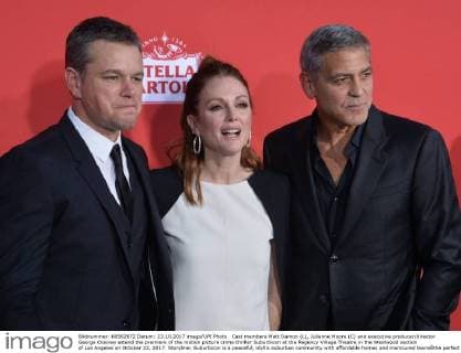 Cast members Matt Damon (L), Julianne Moore (C) and executive producer director George Clooney attend the premiere of the motion picture crime thriller Suburbicon at the Regency Village Theatre in the Westwood section of Los Angeles on October 22, 2017. Storyline: Suburbicon is a peaceful, idyllic suburban community with affordable homes and manicured lawnsÉthe perfect place to raise a family, and in the summer of 1959, the Lodge family is doing just that. But the tranquil surface masks a disturbing reality, as husband and father Gardner Lodge (Matt.Damon) must navigate the townÕs dark underbelly of betrayal, deceit, and violence. This is a tale of.very flawed people making very bad choices. This is Suburbicon.  LAP2017102242 JIMxRUYMEN