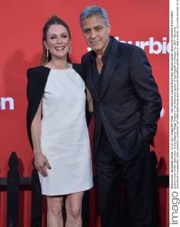 Cast members Julianne Moore and George Clooney attend the premiere of the motion picture crime thriller Suburbicon at the Regency Village Theatre in the Westwood section of Los Angeles on October 22, 2017. Storyline: Suburbicon is a peaceful, idyllic suburban community with affordable homes and manicured lawnsÉthe perfect place to raise a family, and in the summer of 1959, the Lodge family is doing just that. But the tranquil surface masks a disturbing reality, as husband and father Gardner Lodge (Matt.Damon) must navigate the townÕs dark underbelly of betrayal, deceit, and violence. This is a tale of.very flawed people making very bad choices. This is Suburbicon.  LAP2017102228 JIMxRUYMEN