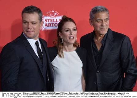 Cast members Matt Damon (L), Julianne Moore (C) and executive producer director George Clooney attend the premiere of the motion picture crime thriller Suburbicon at the Regency Village Theatre in the Westwood section of Los Angeles on October 22, 2017. Storyline: Suburbicon is a peaceful, idyllic suburban community with affordable homes and manicured lawnsÉthe perfect place to raise a family, and in the summer of 1959, the Lodge family is doing just that. But the tranquil surface masks a disturbing reality, as husband and father Gardner Lodge (Matt.Damon) must navigate the townÕs dark underbelly of betrayal, deceit, and violence. This is a tale of.very flawed people making very bad choices. This is Suburbicon.  LAP2017102241 JIMxRUYMEN
