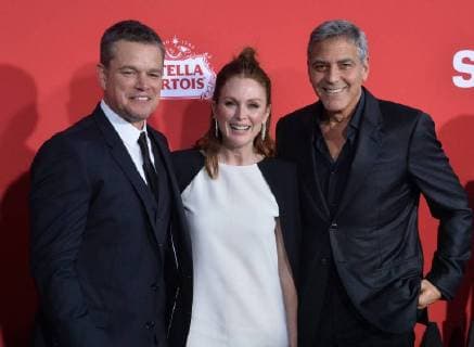 Cast members Matt Damon (L), Julianne Moore (C) and executive producer director George Clooney attend the premiere of the motion picture crime thriller Suburbicon at the Regency Village Theatre in the Westwood section of Los Angeles on October 22, 2017. Storyline: Suburbicon is a peaceful, idyllic suburban community with affordable homes and manicured lawnsÉthe perfect place to raise a family, and in the summer of 1959, the Lodge family is doing just that. But the tranquil surface masks a disturbing reality, as husband and father Gardner Lodge (Matt.Damon) must navigate the townÕs dark underbelly of betrayal, deceit, and violence. This is a tale of.very flawed people making very bad choices. This is Suburbicon.  LAP2017102245 JIMxRUYMEN