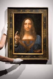 October 24, 2017 - London, London, UK - A Christie s staff member holds a painting titled Salvator Mundi (1490) by artist Leonardo da Vinci with an estimate in excess of 00 million. The painting of Christ as Salvator Mundi was recently attributed to Leonardo da Vinci, who is known to have painted the subject. It was lost and later rediscovered, and restored and exhibited in 2011. London UK  - ZUMAl94_ 20171024_zaf_l94_002 Copyright: xRayxTangx