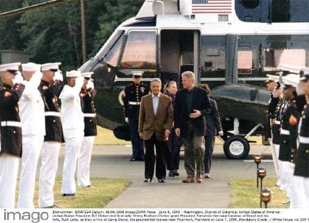 June 8, 1998 - Washington, District of Columbia, United States of America - United States President Bill Clinton and first lady Hillary Rodham Clinton greet President Fernando Henrique Cardoso of Brazil and his wife, Ruth Leite, as they arrive at Camp David, the presidential retreat near Thurmont, Maryland on June 7, 1998..Mandatory Credit: White House via CNP Washington United States of America - ZUMAs152 19980608_zaa_s152_001 Copyright: xSharonxFarmerx